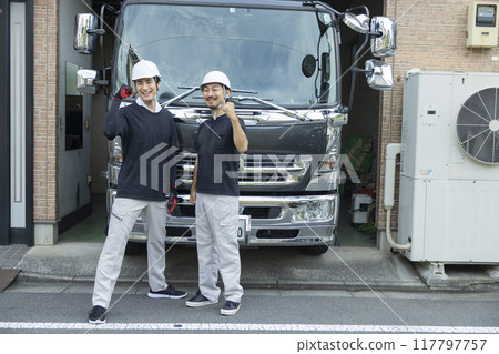 Worker in front of truck Worker in front of truck 117797757
