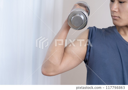 Young man doing muscle training, dumbbells, body parts 117798863
