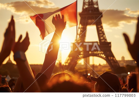 Crowd holding a flag with the Eiffel Tower at sunset in the background. High quality photo Crowd holding a flag with the Eiffel Tower at sunset in the background. High quality photo 117799803