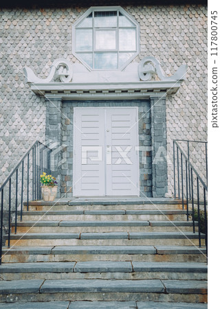 Stone staircase and white porch 117800745