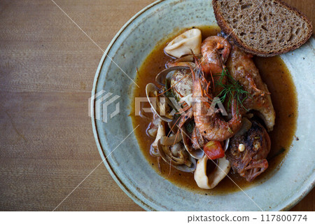 Bouillabaisse and whole wheat bread 117800774