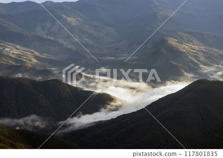 Landscape of Morning Mist with Mountain Layer at north of Thailand. mountain ridge and clouds in rural jungle bush forest Landscape of Morning Mist with Mountain Layer at north of Thailand. mountain ridge and clouds in rural jungle bush forest 117801835