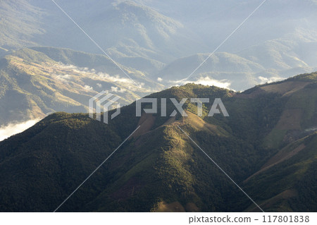 Landscape of Morning Mist with Mountain Layer at north of Thailand. mountain ridge and clouds in rural jungle bush forest 117801838