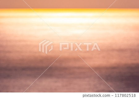 Beautiful sunset or sunrise sky over sea surface background,Blurred background 117802518