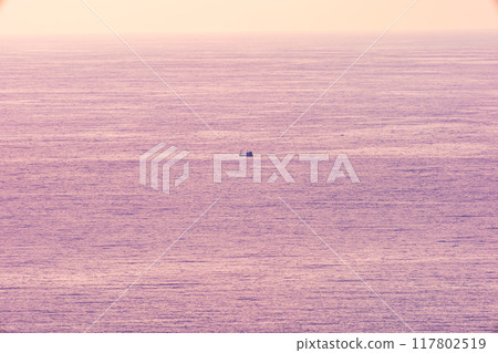 Amazing sunlight beautiful sunset or sunrise nature in golden sky over sea surface background 117802519