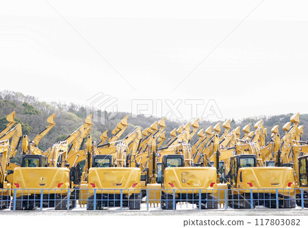 excavator cars lined up 117803082