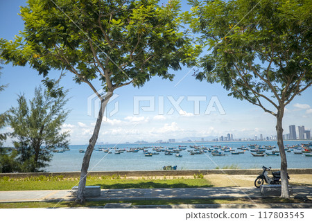 This is a beautiful view of My Khe Beach, a famous tourist attraction in Danang, Vietnam. This is a beautiful view of My Khe Beach, a famous tourist attraction in Danang, Vietnam. 117803545