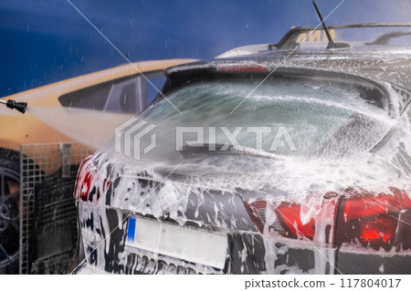 SUV Being Washed at Car Wash SUV Being Washed at Car Wash 117804017