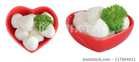 Mini mozzarella balls with parsley in a red ceramic bowl isolated on white background. Top view. Flat lay. Mini mozzarella balls with parsley in a red ceramic bowl isolated on white background. Top view. Flat lay. 117804911
