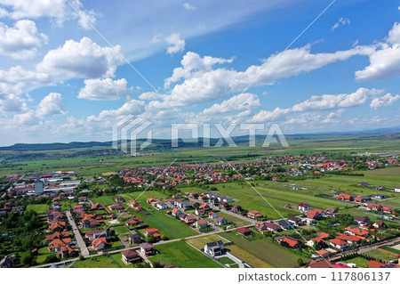 Aerial view of residential neighborhood, village houses in a plain Aerial view of residential neighborhood, village houses in a plain 117806137