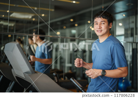 man running on treadmill at fitness gym exercise 117806228