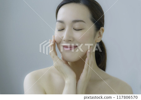 Young woman taking care of your skin Young woman taking care of your skin 117806570