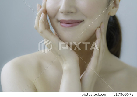 Young woman taking care of your skin Young woman taking care of your skin 117806572