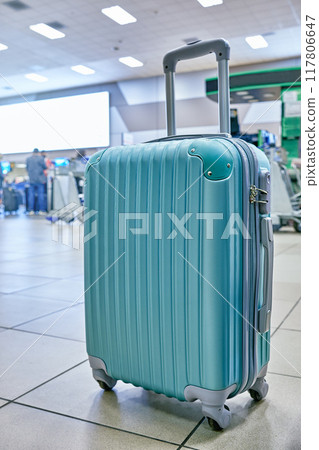 Suitcase or baggage with airport luggage trolley in the international airport, focus on suitcases. Vacation concept 117806647
