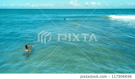 Aerial view the Group of surfers chilling out on the beach. Los Caracas beach, La Guaira - Venezuela. 117806696