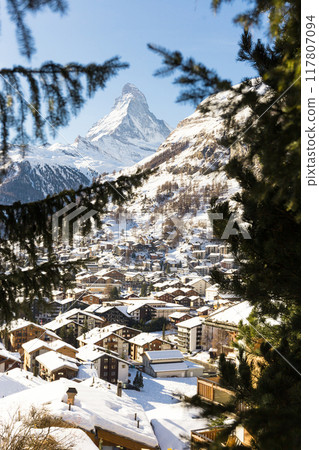 Snowy mountain Matterhorn during the day in winter. Zermatt, swiss alps 117807094