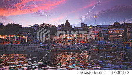 Varanasi, India. Hundreds Of Tourists And Locals Gather On Boats To Watch Fire Ceremony Or Puja At Assi Ghat. Ganga Maha Aarti Ceremony. Traditional Ganga Aarti In Varanasi. Cinematic Camera Movement Varanasi, India. Hundreds Of Tourists And Locals Gather On Boats To Watch Fire Ceremony Or Puja At Assi Ghat. Ganga Maha Aarti Ceremony. Traditional Ganga Aarti In Varanasi. Cinematic Camera Movement 117807180