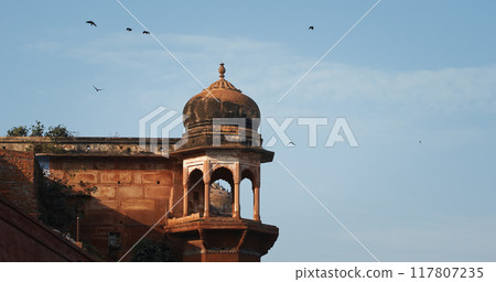 Varanasi, Uttar Pradesh, India. Crows Fly Above Chet Singh Fort, Jain Ghat. Clear Blue Sky. Flight 117807235