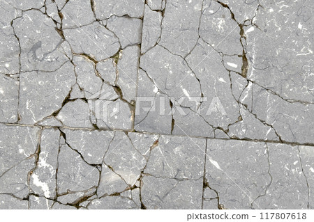 Cracked exterior floor tile abstract distressed surface. Gray abstract broken background Cracked exterior floor tile abstract distressed surface. Gray abstract broken background 117807618
