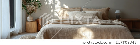 Cozy Minimalist Bedroom with Natural Light and Neutral Tones Featuring Comfortable Bedding and Elegant Decor 117808345