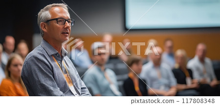 Business Conference Speaker Addressing Audience in Modern Conference Room Business Conference Speaker Addressing Audience in Modern Conference Room 117808348