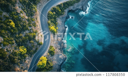 Aerial View of a Winding Coastal Road Along a Cliffside with Turquoise Waters and Lush Greenery Aerial View of a Winding Coastal Road Along a Cliffside with Turquoise Waters and Lush Greenery 117808350