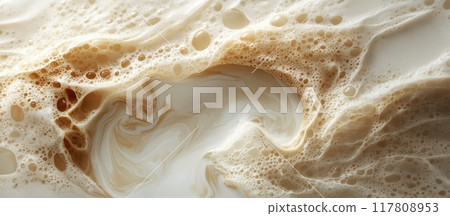 Close-Up of Swirling Coffee Foam and Milk Creating a Beautiful Abstract Pattern 117808953