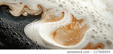 Close-up of Swirling Coffee and Cream with Bubbles Creating a Mesmerizing Abstract Pattern 117808954