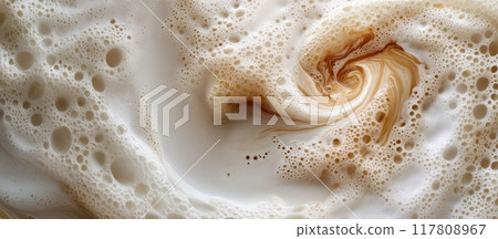 Close-Up of Swirling Coffee Foam with Bubbles Creating a Hypnotic Pattern in a Creamy Beverage 117808967