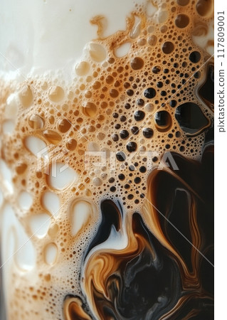 Close-Up of Frothy Coffee with Cream Swirls Creating a Beautiful Abstract Pattern Close-Up of Frothy Coffee with Cream Swirls Creating a Beautiful Abstract Pattern 117809001