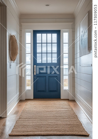 Bright Coastal Entryway with Blue Door and Natural Decor Overlooking Ocean View 117809053