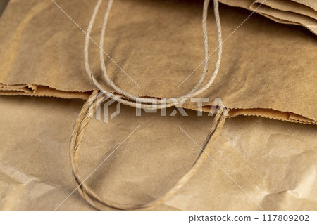 old paper bag for goods made of recycled paper 117809202