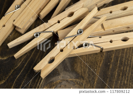 a group of wooden clothespins for drying clothes 117809212