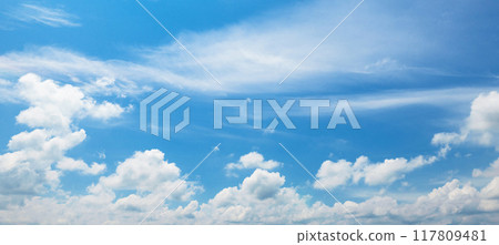 clear blue sky with a few clouds 117809481