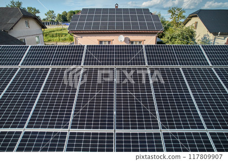 Aerial top view of new modern house cottage with solar photovoltaic panel system on house roof 117809907