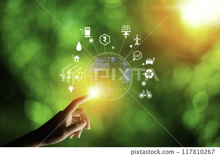 concept eco earth day. green tree growing in a light bulb On the background blurred image of green leaves and there is a golden light in the morning. energy saving and environmental protection.. concept eco earth day. green tree growing in a light bulb On the background blurred image of green leaves and there is a golden light in the morning. energy saving and environmental protection.. 117810267