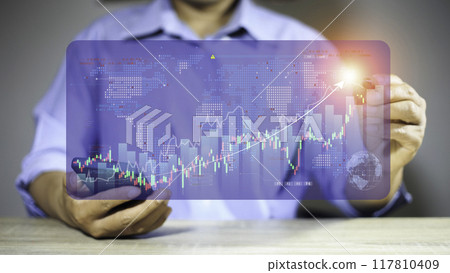 Business or trader is showing growing virtual hologram stocks, investing in trading.Business success concept . concept wealth stock investment.Business growth in the digital age. business growth. 117810409