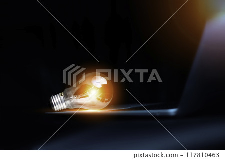 light bulb on laptop keyboard, new idea innovation technology concept. idea inspired by innovation.Success starts from new ideas to innovative technologies based on internet big data. 117810463