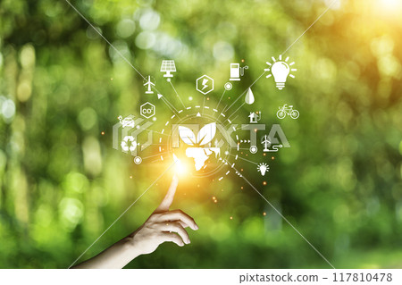 green energy concept help reduce global warming..Hand holding natural background light bulb on green leaf with clean energy icon around it. Carbon dioxide emission in industry zero carbon concept.. green energy concept help reduce global warming..Hand holding natural background light bulb on green leaf with clean energy icon around it. Carbon dioxide emission in industry zero carbon concept.. 117810478