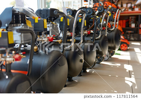 Display of modern compressor machine assortment at hardware store department Display of modern compressor machine assortment at hardware store department 117811564