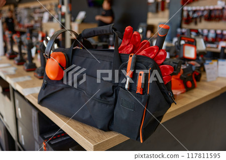 Bag with different tools for repair and maintenance at hardware store 117811595