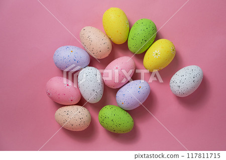 Painted quail eggs on a pink background. Easter decorations. Painted quail eggs on a pink background. Easter decorations. 117811715