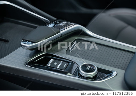 Close-up of an automatic transmission of a modern car. Close-up of an automatic transmission of a modern car. 117812396