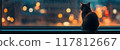 Cozy Cat Sitting by Rainy Window at Night with City Lights in Background 117812667