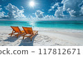 Tropical Beach with Wooden Lounge Chairs and Turquoise Water Under a Bright Sunny Sky 117812671