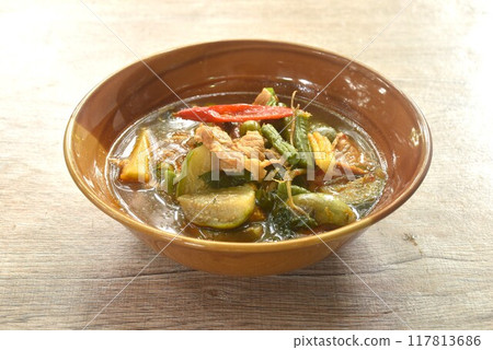 spicy boiled pork with mixed vegetable in jungle curry soup Thai food in bowl spicy boiled pork with mixed vegetable in jungle curry soup Thai food in bowl 117813686