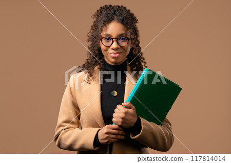College smiling african student girl with papers folder.Academic teen, education College smiling african student girl with papers folder.Academic teen, education 117814014