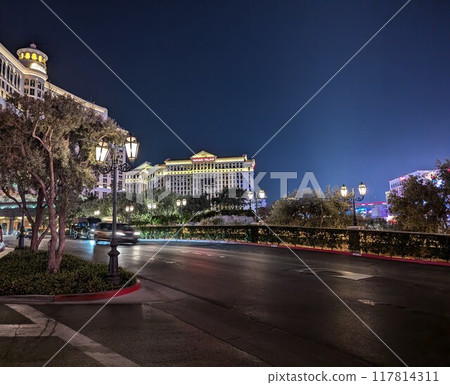 Las Vegas, USA - 08.06.2024 View of the Caesars Palace and Bellagio Hotel and casino at night. Las Vegas, USA - 08.06.2024 View of the Caesars Palace and Bellagio Hotel and casino at night. 117814311