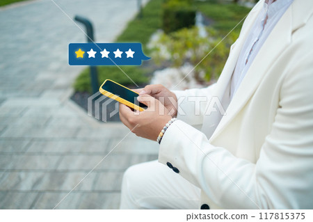 Customer satisfaction experience concept. Businessman using mobile phone giving 1 star icon and excellent for feedback review satisfaction service. rating very impressed. Customer satisfaction experience concept. Businessman using mobile phone giving 1 star icon and excellent for feedback review satisfaction service. rating very impressed. 117815375