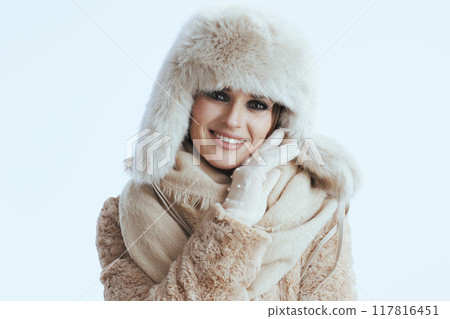happy stylish woman touching face on white 117816451
